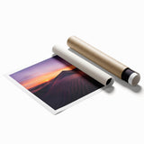 Desert landscape wall art print showcasing vibrant orange and yellow hues, rolled and ready for framing, perfect for adding warmth to contemporary decor.