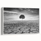 Framed canvas wall art showcasing a serene desert landscape in warm hues, featuring cacti and mountains, designed to enhance modern home decor.