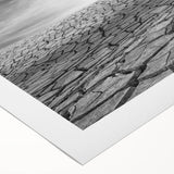 Vibrant rolled canvas artwork showcasing an abstract desert landscape design, featuring warm earth tones and intricate details, perfect for modern home decor.