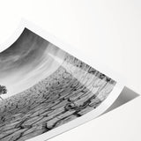 Desert landscape wall art print showcasing vibrant hues of orange and yellow with intricate details, rolled for easy display and shipping. Perfect for home decor.