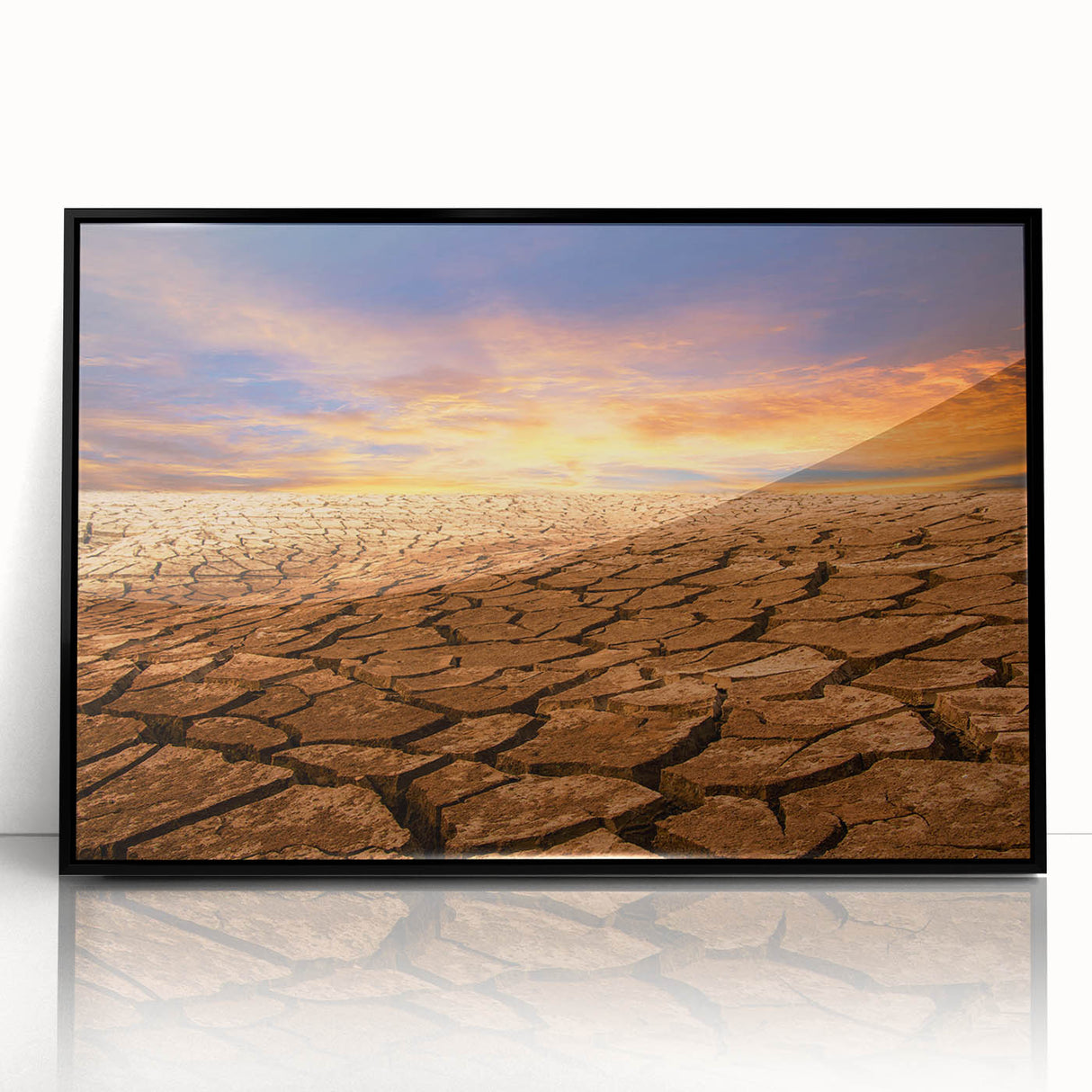 Framed acrylic wall art showcasing a stunning desert landscape design, featuring warm tones of orange and yellow, highlighted by a sleek black frame, perfect for modern decor.