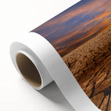 Vibrant rolled canvas wall art depicting an abstract desert landscape design, showcasing warm earth tones and dynamic shapes, perfect for modern decor.