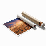 Desert landscape wall art collection print showcasing vibrant hues of orange and yellow, rolled and ready for display, capturing the essence of arid beauty.