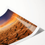 Desert landscape wall art print showcasing vibrant hues of orange and red, depicting a serene sunset over sand dunes, rolled for easy display and shipping.