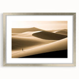 Framed wall art showcasing a serene dune landscape design, featuring soft beige and gold tones with a silver matting, perfect for enhancing home decor aesthetics.