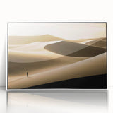 Framed wall art featuring a stunning desert dune landscape design in soft beige and warm orange tones, showcased with a sleek white frame for an elegant touch.