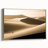 Framed canvas wall art showcasing a serene desert dune landscape design, featuring soft beige and gold colors, with a sleek silver frame, perfect for modern decor.