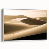 Framed canvas wall art showcasing a serene desert dune landscape in soft beige and white tones, designed to enhance modern home decor with its elegant side view.