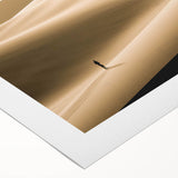 Rolled canvas print showcasing a stunning desert landscape with golden dunes at sunset, perfect for adding a warm, natural touch to any interior decor.