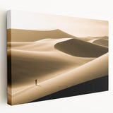 Stretched canvas wall art depicting a serene desert landscape with rolling dunes at sunset, showcasing warm golden and orange hues, perfect for home decor.
