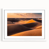 Framed wall art showcasing a serene desert landscape with golden sand dunes, presented in a sleek white mat and frame, ideal for modern home decor.