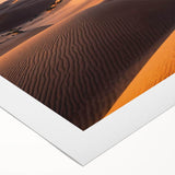 Rolled canvas showcasing a vibrant desert landscape with golden dunes and a clear blue sky, perfect for home decor or artistic inspiration. Ideal for nature enthusiasts.