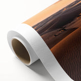 Rolled canvas artwork showcasing a vibrant desert landscape, featuring golden sand dunes under a clear blue sky, ideal for home decor enthusiasts.