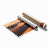 Vibrant rolled print of a desert landscape featuring golden sand dunes under a blue sky, ideal for home decor and art enthusiasts, capturing serene natural beauty.