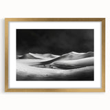Framed wall art featuring a serene desert dune landscape design in soft earth tones, accented by a gold mat and frame, perfect for home decor.