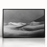 Framed acrylic wall art featuring a serene desert dune landscape with soft beige and golden tones, designed to enhance modern home decor. Ideal for nature enthusiasts.