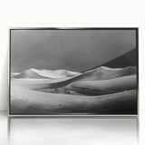 Framed acrylic wall art showcasing a serene desert landscape with golden dunes and a vibrant sunset, elegantly designed to enhance modern interiors.