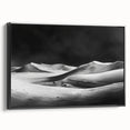 Framed canvas wall art showcasing a serene desert landscape with golden sand dunes, featuring a sleek black frame, ideal for modern home decor accents.