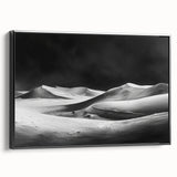 Framed canvas wall art showcasing a serene desert landscape with golden sand dunes, featuring a sleek black frame, ideal for modern home decor accents.
