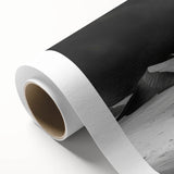 Rolled canvas art showcasing a vibrant desert landscape with undulating dunes and a warm sunset, designed for wall décor, delivered in protective cardboard packaging.