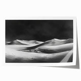 Vibrant rolled print of desert dunes landscape, showcasing rich golden and orange hues, perfect for home decor, packaged securely in a protective tube.