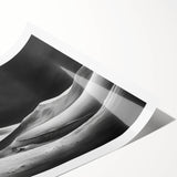 Vibrant rolled wall art print showcasing an abstract desert landscape with soft dunes in warm hues, elegantly packaged in a protective cardboard tube for easy storage.