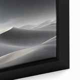 Close-up of a framed canvas wall art piece showcasing a serene desert landscape with golden sand dunes and a vibrant blue sky, perfect for home decor.