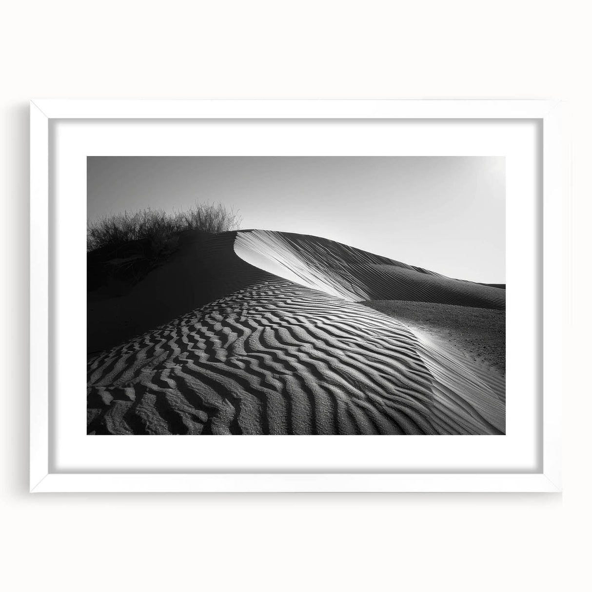 Framed wall art showcasing a serene desert landscape with rolling dunes, featuring a minimalist white mat and frame, ideal for modern home decor and interior design.