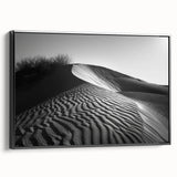 Framed wall art canvas featuring a serene desert landscape with golden dunes and a soft blue sky, showcasing a modern design with a sleek black frame, perfect for home decor.