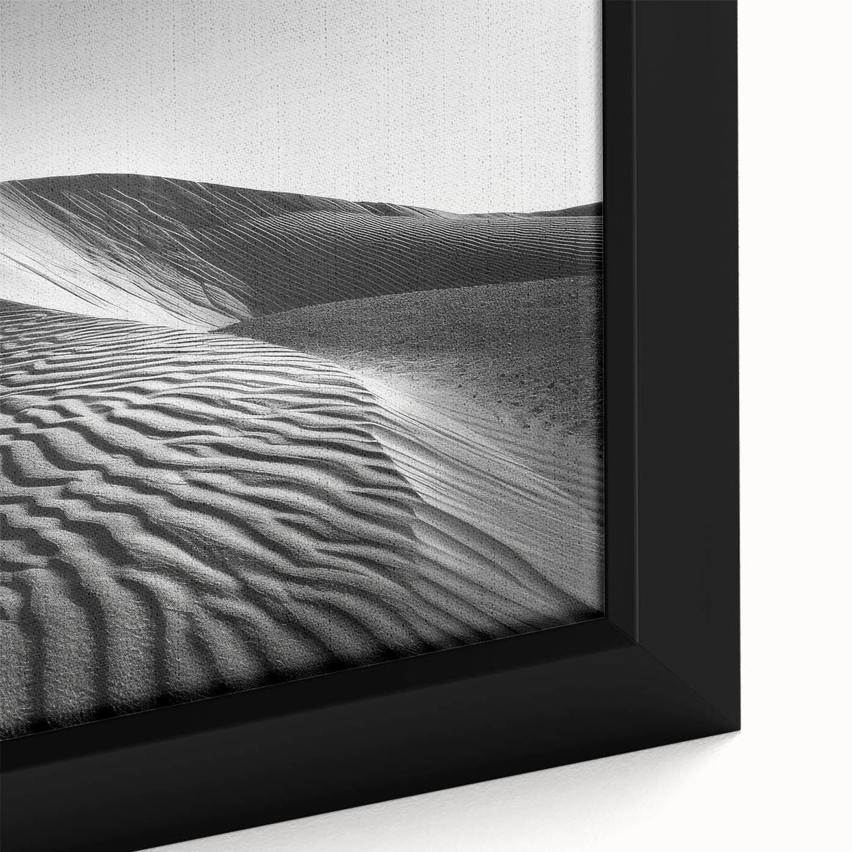 Framed canvas wall art showcasing a close-up of serene sand dunes, emphasizing warm beige and golden tones, perfect for enhancing modern interior decor.