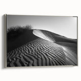 Framed canvas wall art depicting serene sand dunes under a clear sky, featuring a silver frame that enhances the modern design, perfect for home decor.