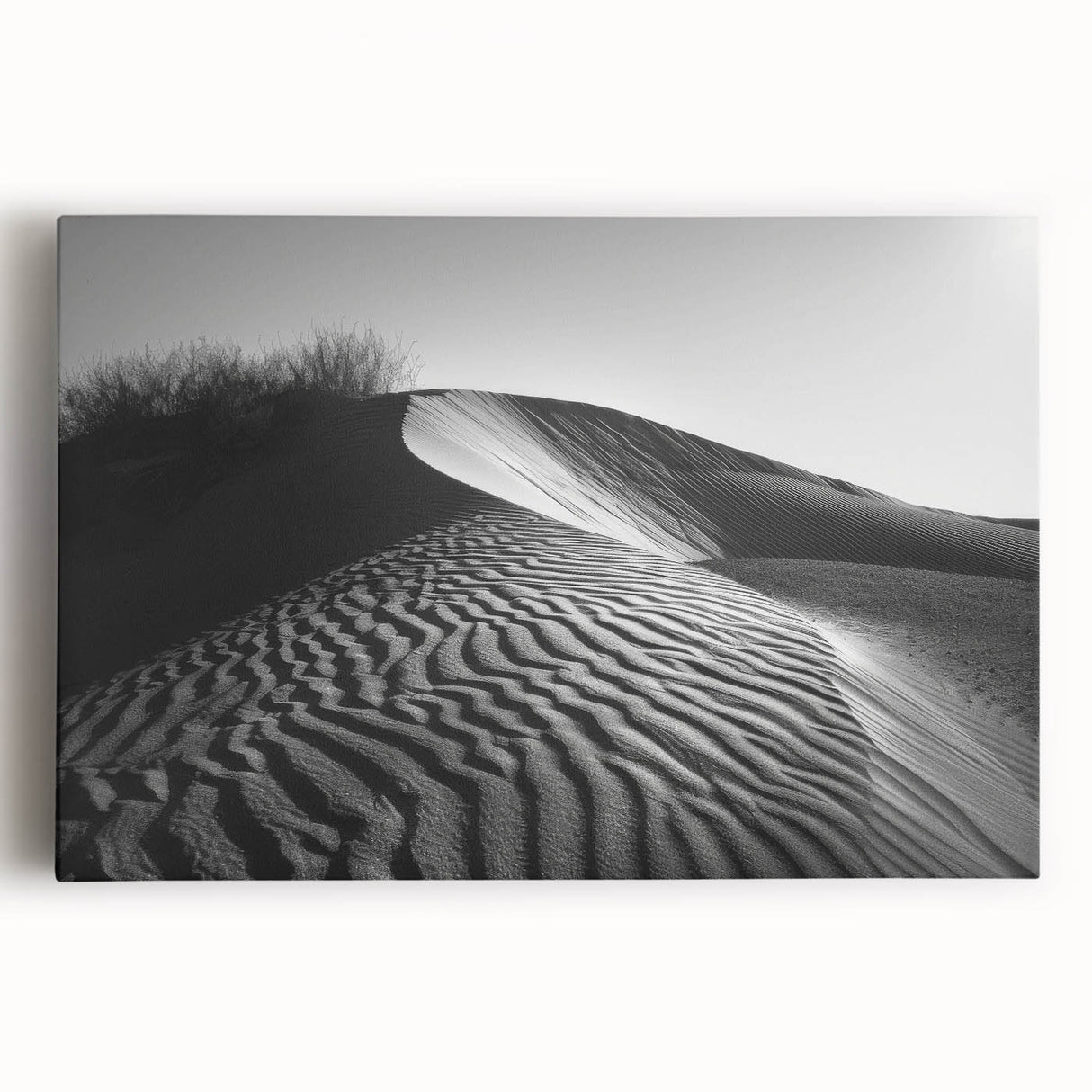 Stretched canvas wall art depicting a serene desert landscape with rolling sand dunes, warm golden tones, and a tranquil sky, ideal for modern home decor.