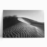 Stretched canvas wall art featuring a serene desert landscape with soft beige dunes and a vibrant blue sky, perfect for enhancing modern home decor.