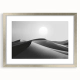 Framed wall art from the "Landscapes Dunes Design 2" collection, showcasing a serene desert scene with soft sand dunes in neutral tones, accented by a sleek silver frame and matting, ideal for modern home decor.