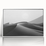 Framed acrylic wall art showcasing a serene desert dunes landscape in soft beige and gold tones, designed to enhance modern home decor aesthetics.