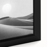 Close-up of a framed canvas featuring a serene desert landscape with rolling dunes, soft golden hues, and intricate details, perfect for home decor.