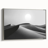 Framed canvas wall art showcasing a serene desert landscape with rolling sand dunes and soft pastel colors, elegantly bordered with a silver frame, ideal for modern home decor.