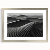 Framed wall art featuring a serene desert dunes landscape design, with a silver mat and frame, showcasing soft beige and sandy tones, ideal for modern home decor.