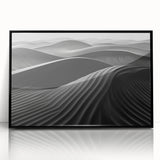 Framed acrylic wall art featuring a serene desert dunes landscape design, showcasing soft beige and warm orange hues, perfect for modern interior decor.