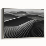 Framed canvas artwork showcasing a serene desert landscape with golden dunes, highlighted by a silver frame, ideal for modern home decor.