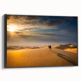 Framed canvas artwork showcasing a serene desert landscape with golden dunes and a blue sky, presented in a sleek black frame, ideal for modern home decor.
