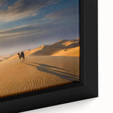 Framed canvas wall art featuring a serene desert landscape with rolling dunes and soft, warm hues, perfect for enhancing modern home decor.