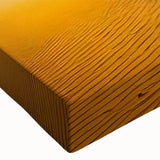 Close-up of a stretched canvas print displaying a vibrant desert landscape with rolling dunes, showcasing rich textures and warm hues, perfect for home decor.