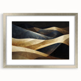 Framed wall art featuring a serene desert dune landscape in shades of gold and beige, accented with a silver mat, perfect for modern home decor.