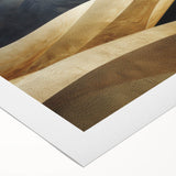 Rolled canvas wall art showcasing a serene desert landscape with flowing dunes, designed in warm beige and golden hues, perfect for enhancing modern interiors.