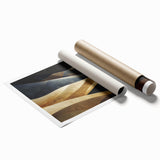 Rolled print of a serene desert landscape featuring golden sand dunes under a clear blue sky, ideal for modern home decor or office spaces.