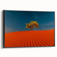Framed canvas wall art showcasing a serene desert dune landscape in warm tones, featuring a sleek black frame, perfect for modern home decor.