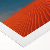 Rolled canvas showcasing a stunning desert landscape with golden dunes and a vibrant blue sky, perfect for enhancing modern home décor aesthetics.