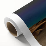 Vibrant rolled canvas wall art showcasing an abstract desert landscape with golden dunes and a serene blue sky, ideal for modern home decor.