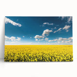 Stretched canvas featuring a scenic landscape of vibrant green fields under a bright blue sky, perfect for home decor, adding a serene touch to any room.